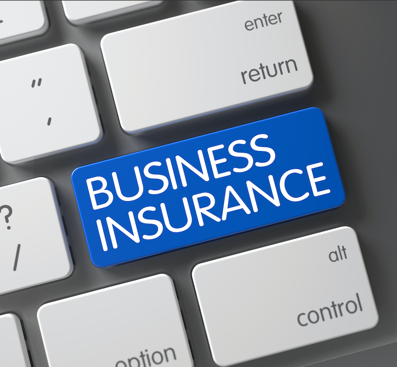 Business insurance text displayed on a computer keyboard, representing Capital Premium Financing services.