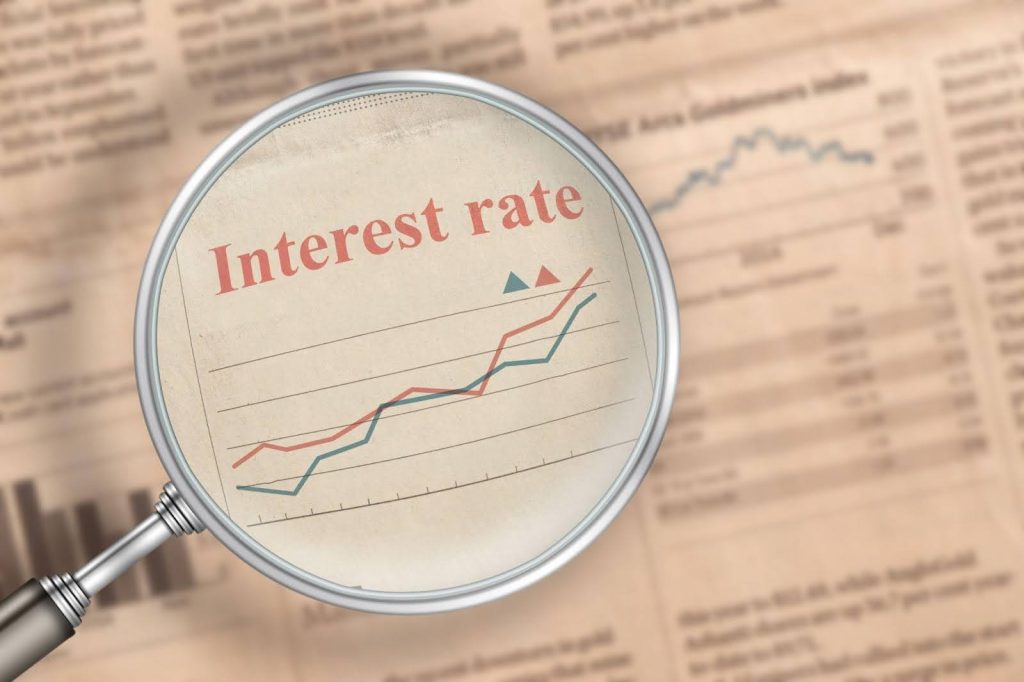 Close-up of a newspaper showing the current interest rate prominently displayed in a financial section