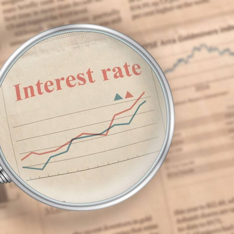 Close-up of a newspaper showing the current interest rate prominently displayed in a financial section