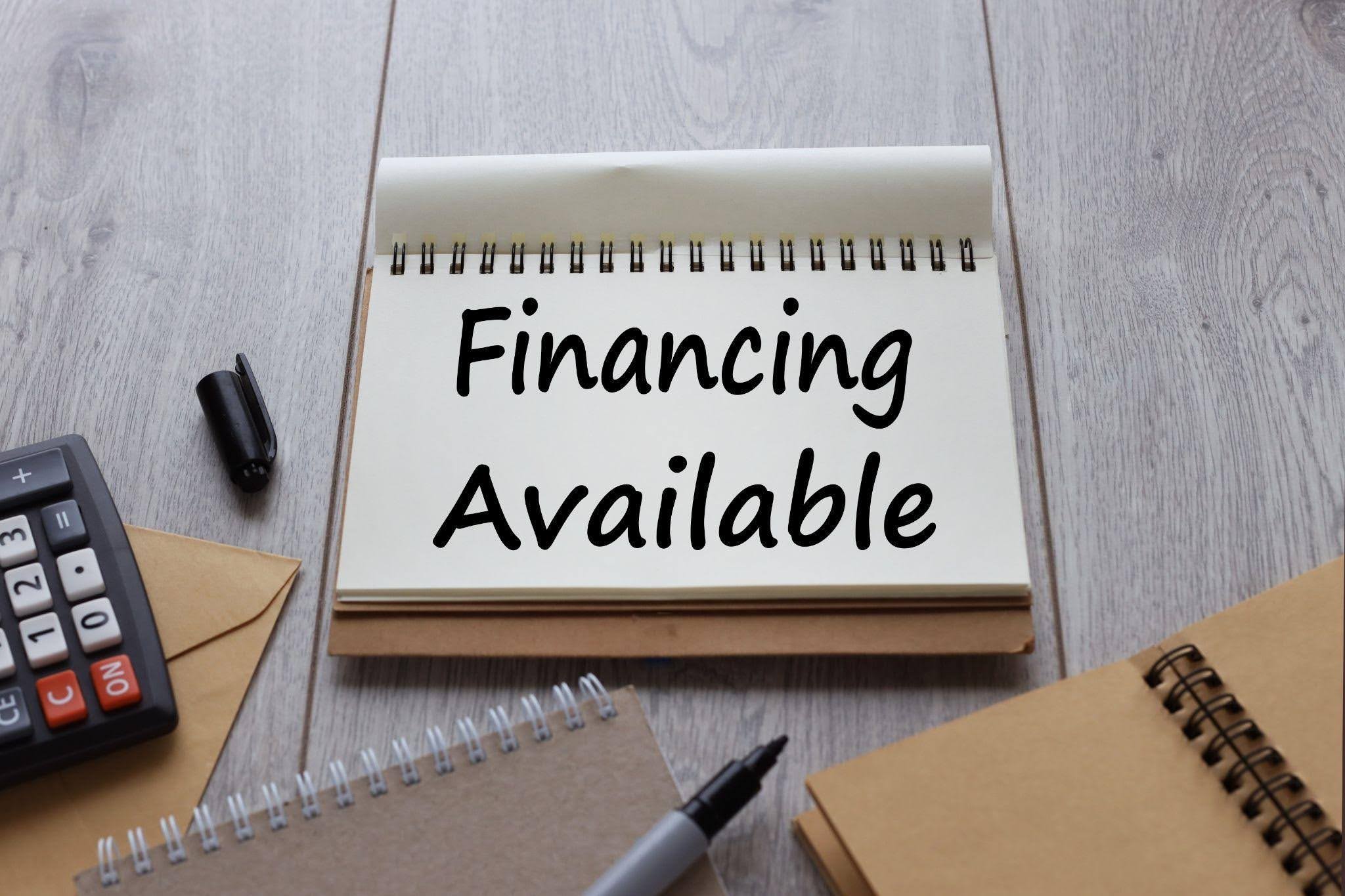 A notepad displaying financial figures and notes emphasizing budgeting and financial planning